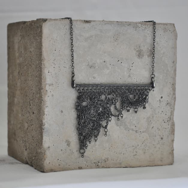 Katherine James Jewellery necklace displayed on concrete block